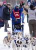 Beargrease vice-president Frank Moe gets a high five from his handler (and wife) Sherri Moe in the 2018 race. Photo CJ Heithoff